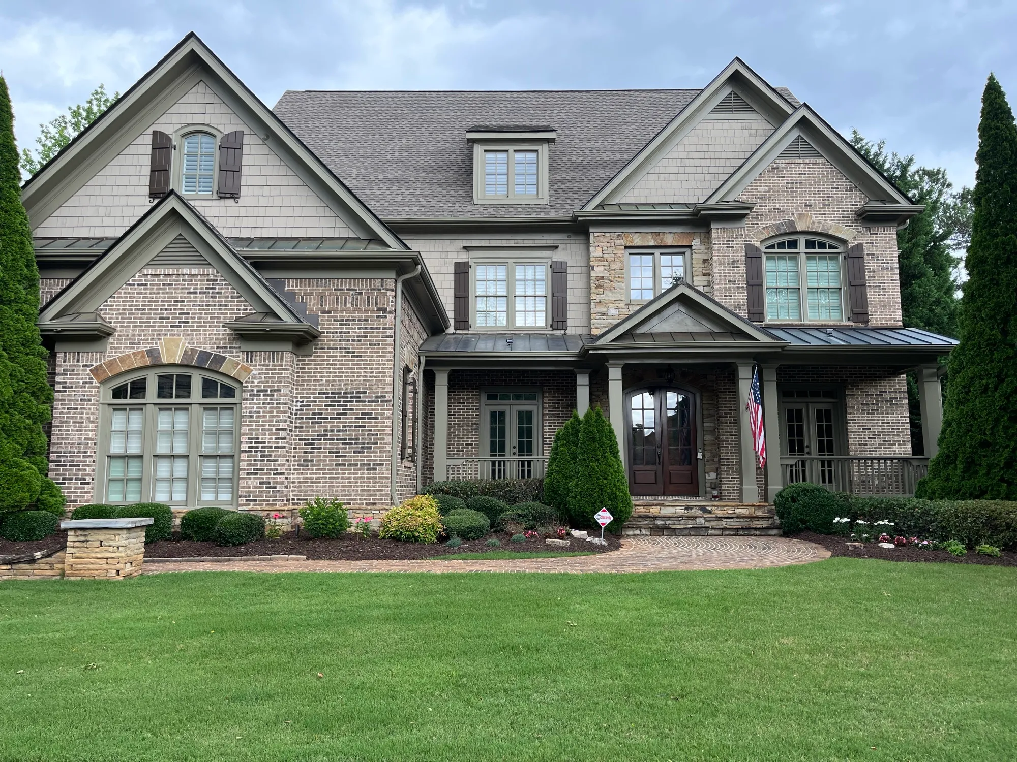 Streak-free windows on a large brick and stone traditional home